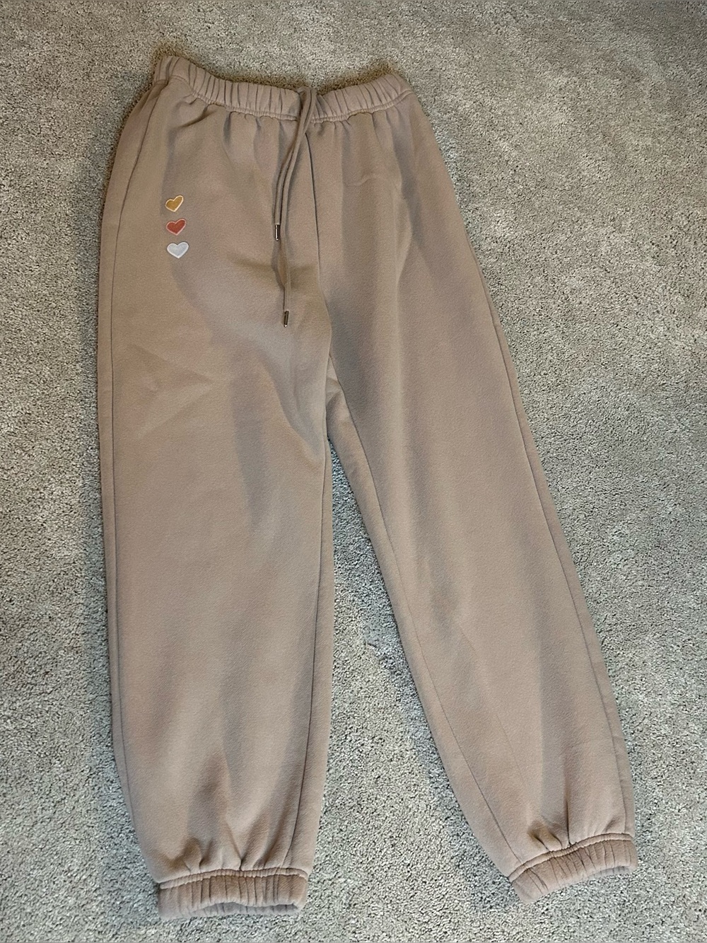 Sweatpants with heart patches